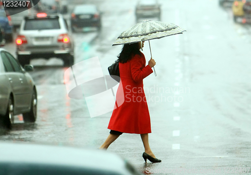 Image of women cross the street