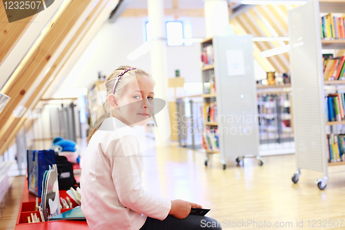 Image of Child reading in library