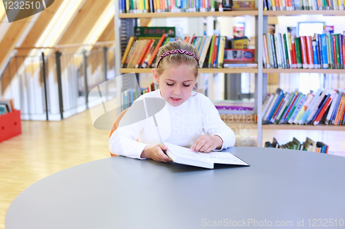 Image of Child reading in library