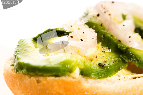 Image of Sandwich with avocado on a wooden board 