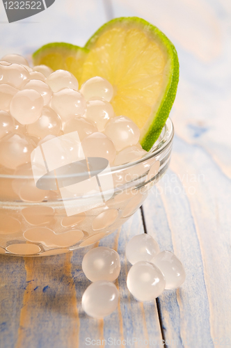 Image of tapioca pearls with lime. white bubble tea ingredients