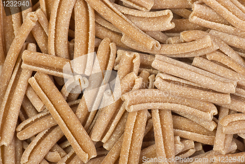 Image of Food background: uncooked bran pasta
