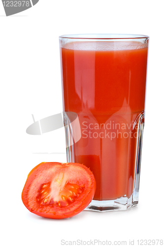 Image of Drinking glass with tomato juice and ripe fresh tomato near