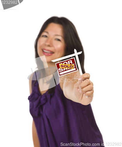 Image of Multiethnic Woman Holding Small Sold Real Estate Sign