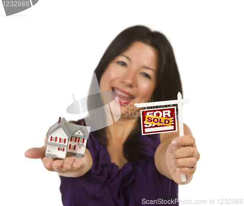 Image of Multiethnic Woman Holding Small Sold For Sale Real Estate Sign a