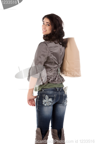 Image of young woman with shopping and cash