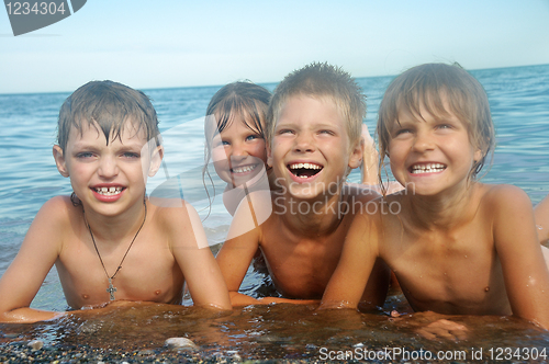 Image of happy children at the beach