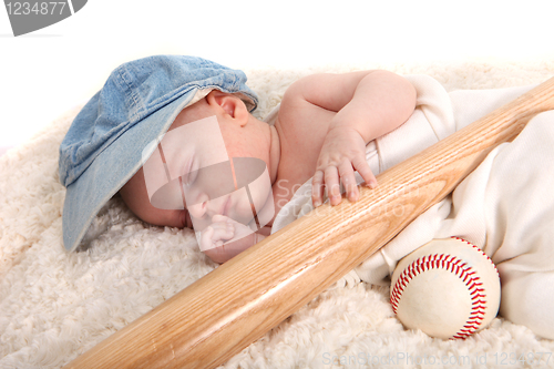 Image of Baby Boy Sleeping With a Baseball Bat and Ball