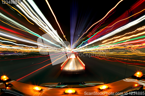 Image of Intentional Blur Image of Driving at Night With City Lights and