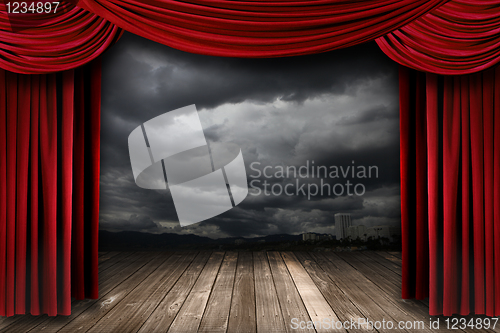 Image of Bright Stage With Red Velvet Theater Curtains