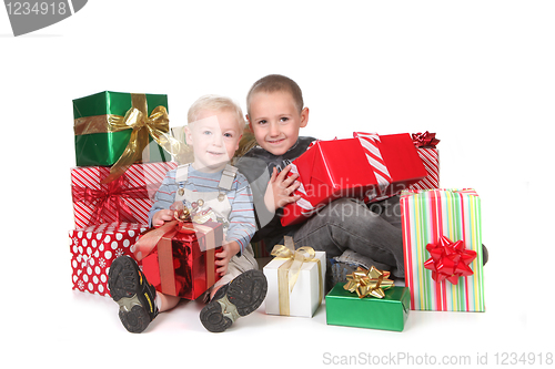 Image of Kids Having a Good Christmas With Lots of Presents