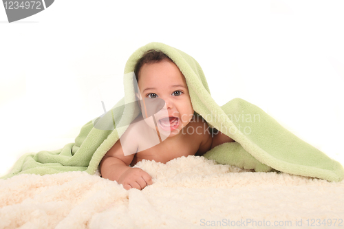 Image of Excited Baby Boy With Blankets on a White Background