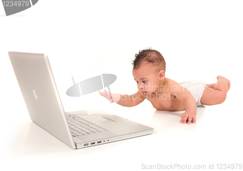 Image of Infant Boy Playing With a Laptop Computer