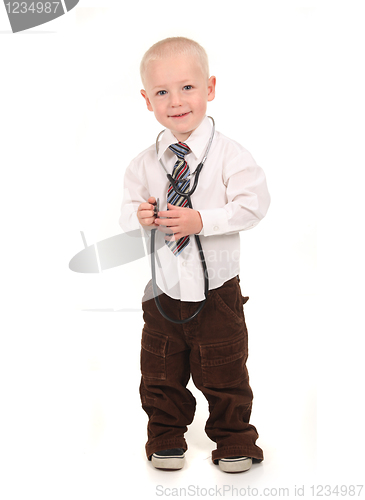Image of Standing Child Pretending to be a Doctor