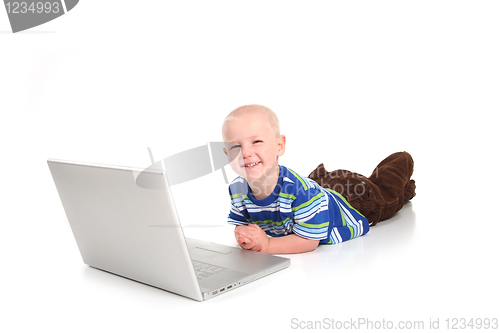 Image of Little Boy Learning to Use a Laptop Computer