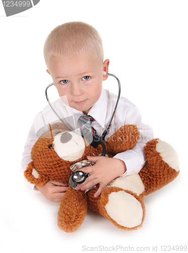 Image of Child Pretending to be a Doctor With his Teddy Bear