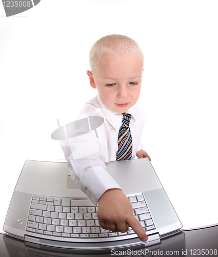 Image of Little Boy in a Suit Working on a Laptop Computer