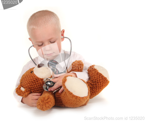 Image of Doctor With Stethoscope and Teddy Bear as a Patient