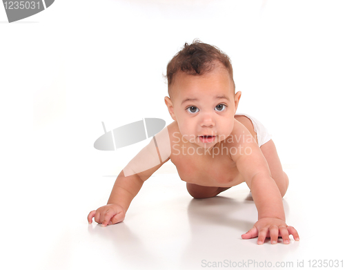 Image of Infant Baby Boy Learning to Crawl on White