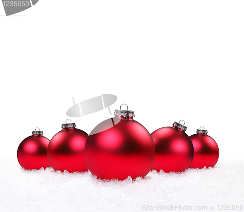 Image of Holiday Ornaments Lying in the Snow