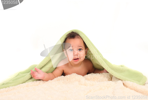 Image of Infant Boy Lying on His Tummy Among Blankets