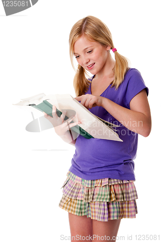 Image of Happy school girl reading and learning