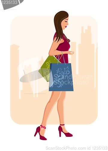 Image of girl with shopping bags, urban background