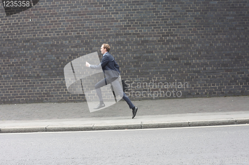Image of Business man running
