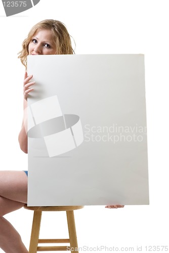 Image of Woman sitting  holding blank sign