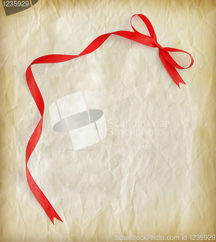 Image of Red ribbon on old paper