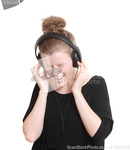 Image of Woman listening to music