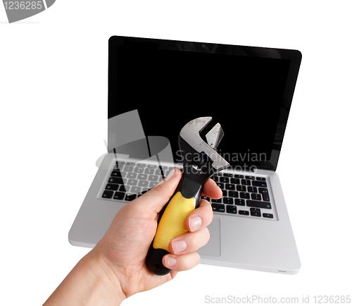 Image of Man fixing computer