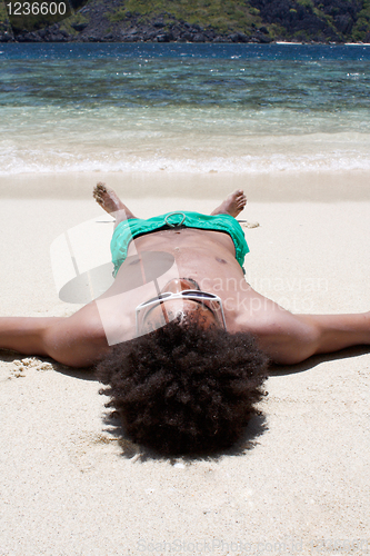 Image of Sleeping on beach