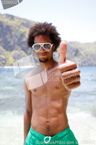 Image of Happy guy on the beach