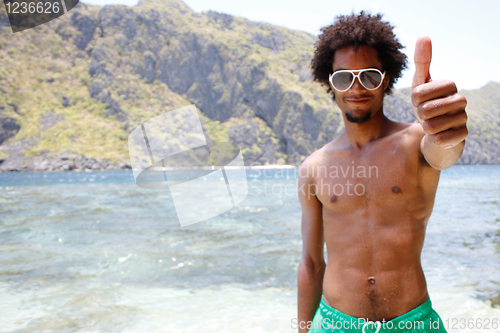 Image of Happy guy on the beach