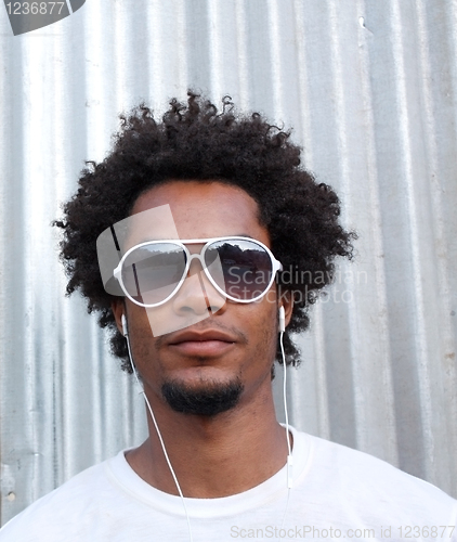 Image of Man listening to music