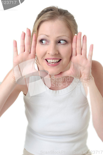 Image of cute woman framing face with hands