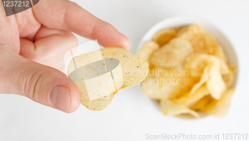Image of Hand with potato chip