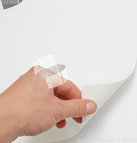 Image of Hand turning page