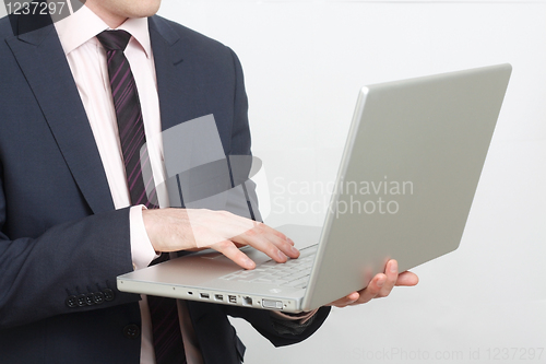 Image of Business man with laptop