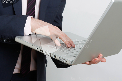 Image of Business man with laptop