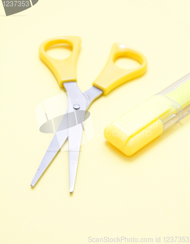 Image of Yellow scissors and a marker