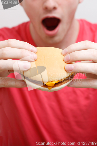 Image of Man eating burger