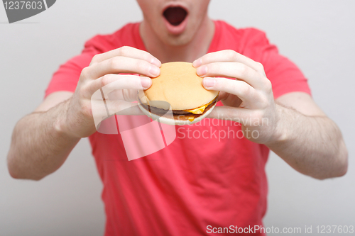 Image of Man eating burger