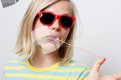 Image of Girl playing with gum