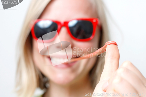 Image of Girl playing with gum