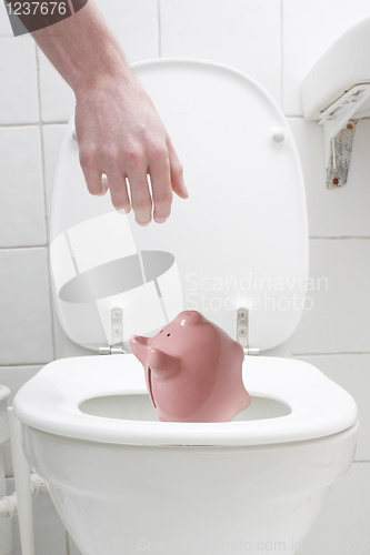 Image of Throwing the piggy bank out