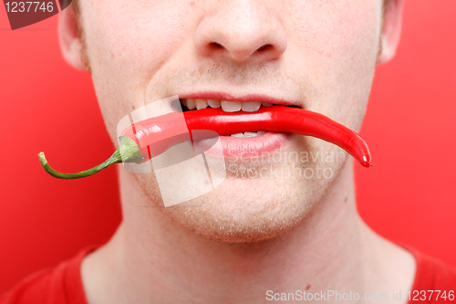 Image of Eating chili pepper