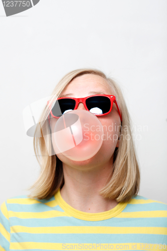 Image of Girl playing with gum