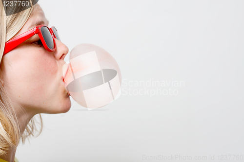 Image of Girl playing with gum